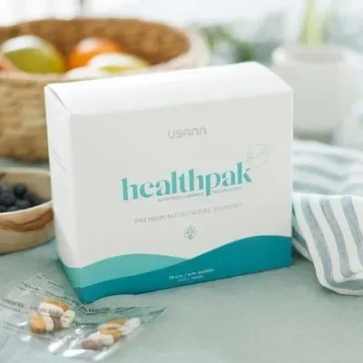 USANA HealthPak supplement box on a table with a blurred background